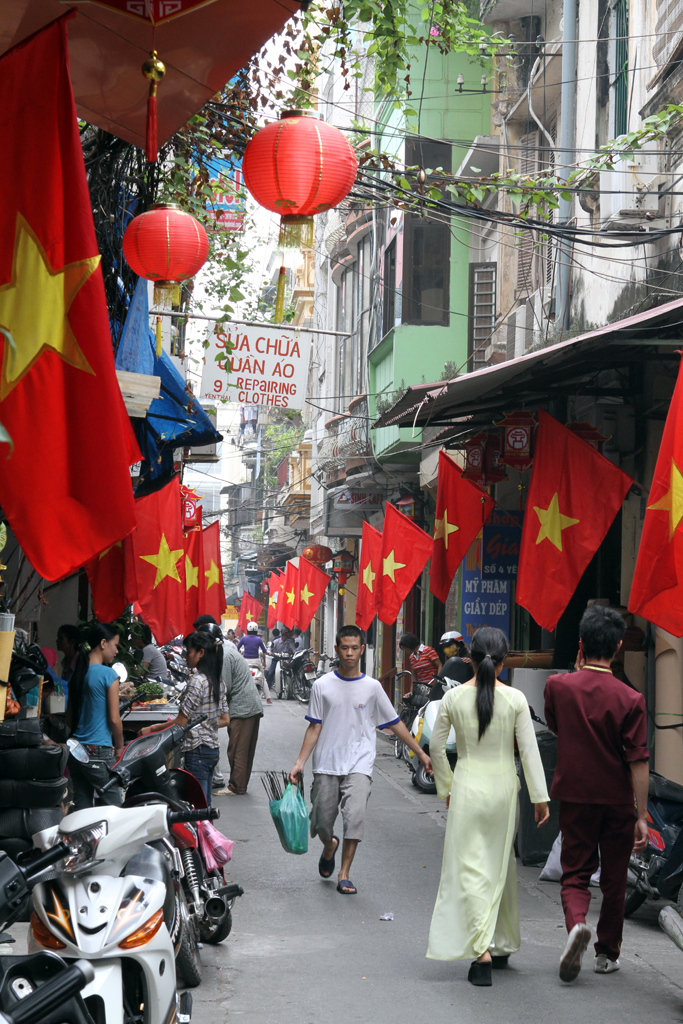 The streets of Hanoi are filled with patriotic flags and more motorbikes than I've ever seen in all my flashpacking.