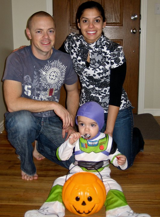 ryan1 My nephew Cayden masquerades as Buzz Lightyear for Halloween with my brother Ryan and sister-in-law Maria behind.