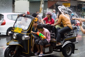 Songkran A tuk tuk races through the water gauntlet that is the streets of Chiang Mai during Songkran.