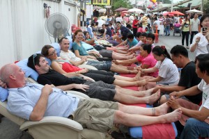 Team_CM Members of Team Chiang Mai (a loose group of travelers living in Chiang Mai) getting foot massages at the Sunday Market.